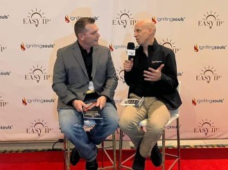 Richard and Kary Oberbrunner in a book-launch interview with a microphone