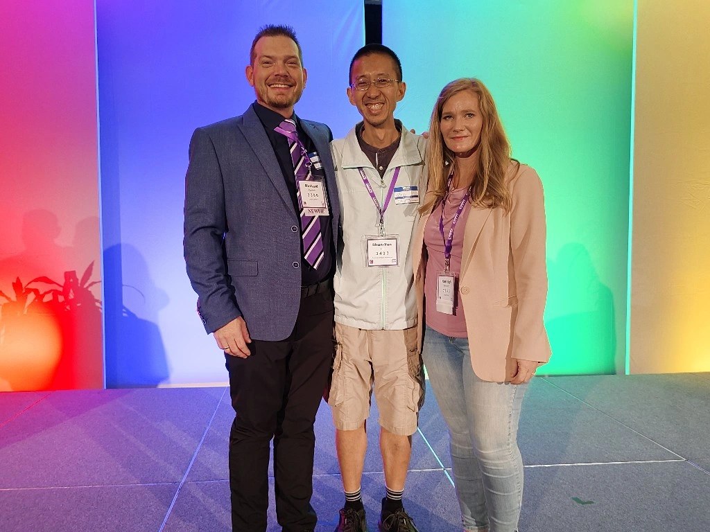 Richard pictured with fellow certified Kolbe consultants on the colourful Kolbe Con stage